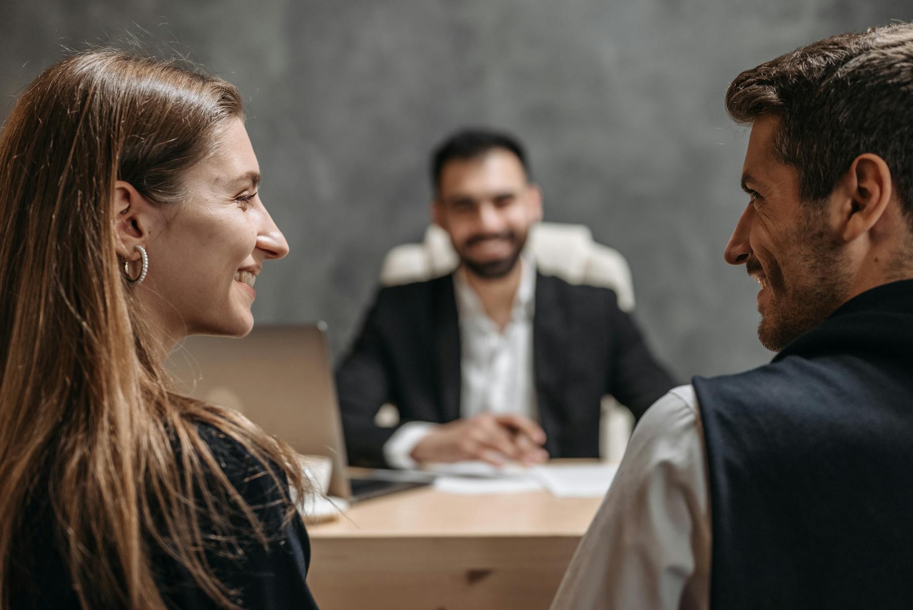 Law firm team reviewing matter files together in a small office